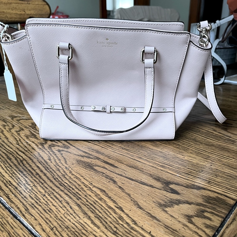 Dust pink Kate Spade pocket book.